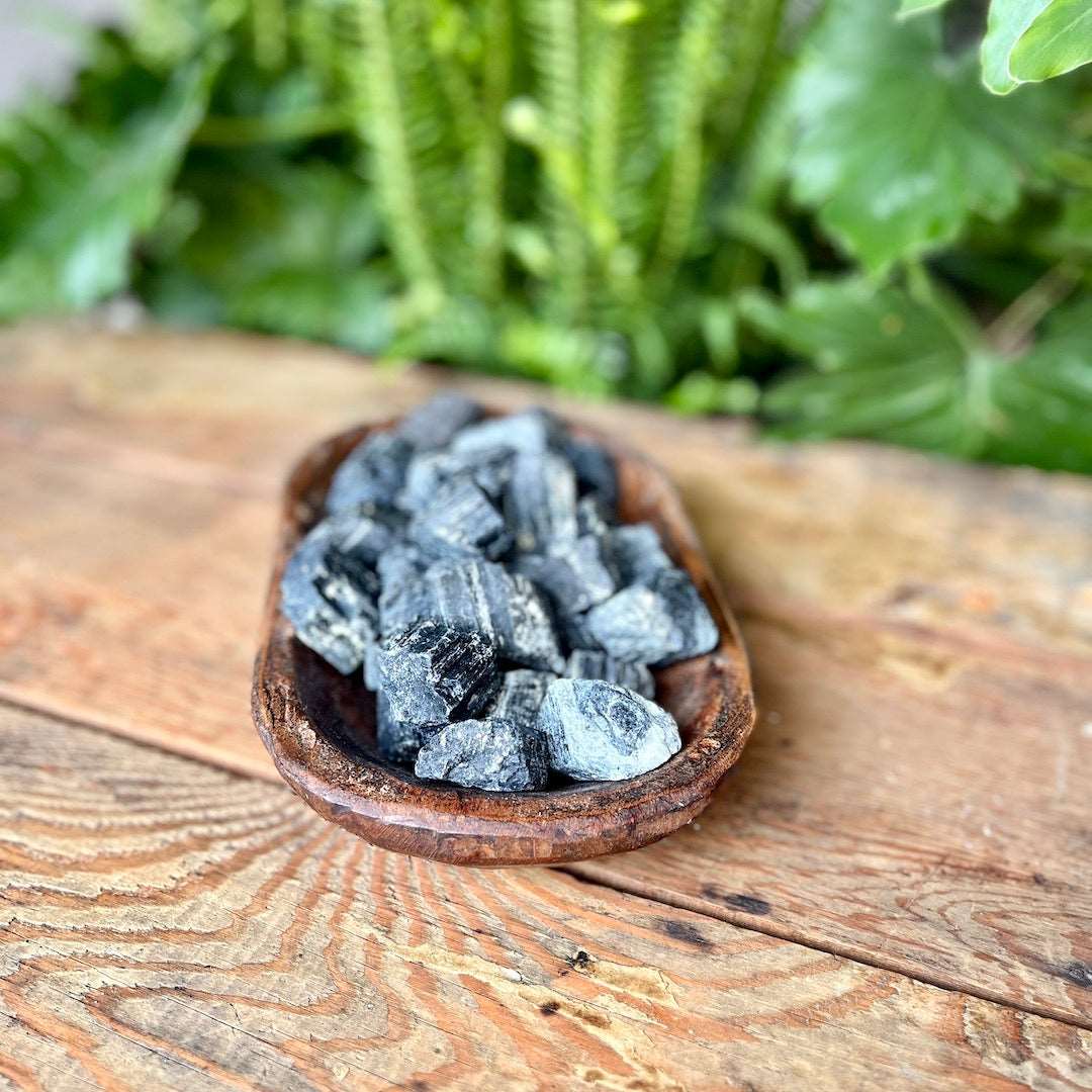 Rough Black Tourmaline Crystal - A potent protective stone, Black Tourmaline wards off negativity and promotes grounding. Experience its shielding energy.
