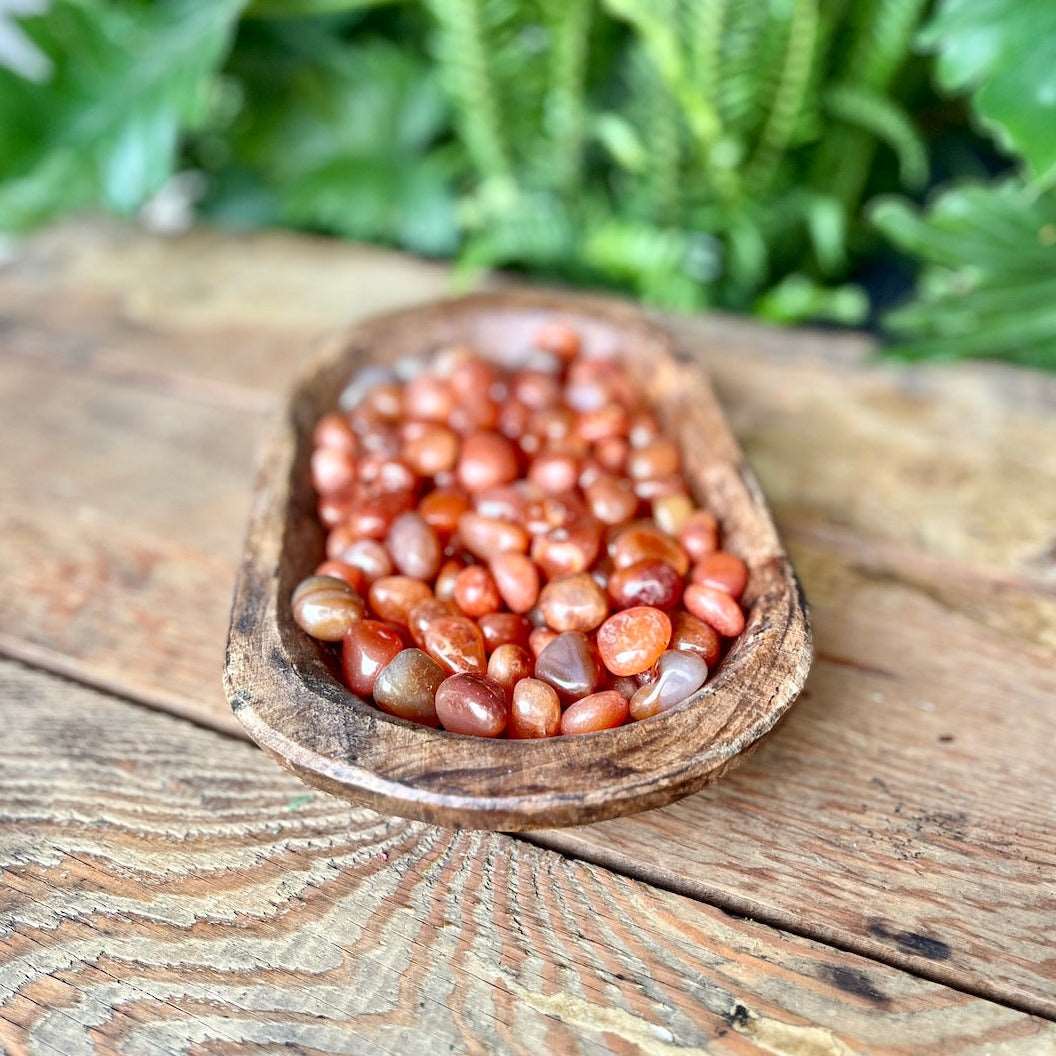 Carnelian Tumbled Crystal - Embrace the warm energies of Carnelian. Known for vitality and motivation, this crystal is believed to enhance courage and creativity. Keep it close to ignite your passion and inner fire.