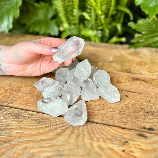 Rough Clear Quartz Crystal - Elevate your energy with Clear Quartz. Revered as a master healer, this crystal is thought to amplify intentions and purify energies. Embrace the clarity and revitalizing properties of Clear Quartz.