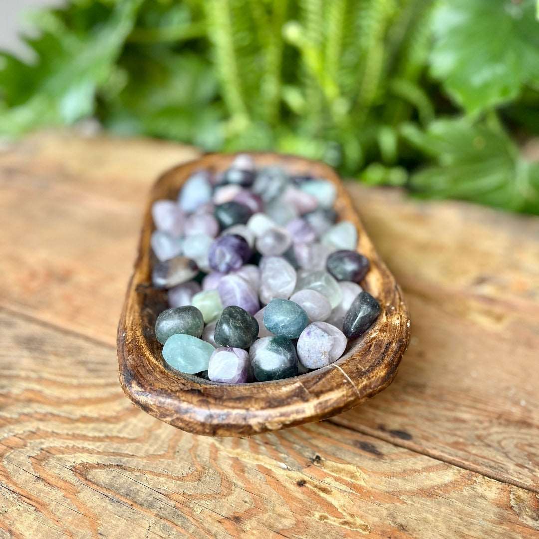 Fluorite Tumbled Crystal - Embrace the harmonizing energies of Fluorite. Known for its calming and stabilizing effects, Fluorite is believed to enhance focus and intuition. Keep this tumbled stone for mental clarity and balance.