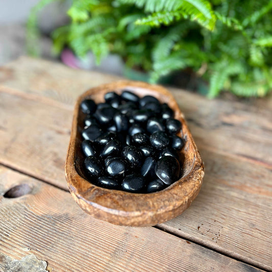 Obsidian Tumbled Crystal - Harness the protective power of Obsidian. This jet-black crystal is revered for its ability to absorb negative energies, promoting clarity and grounding. Embrace the strength of Obsidian in your crystal collection.