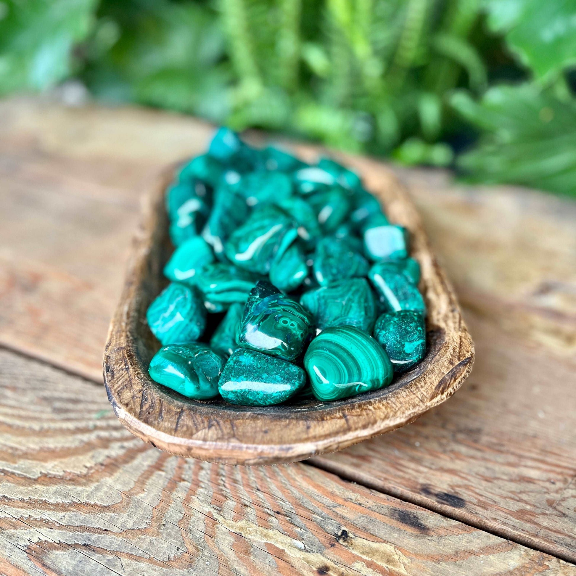 Malachite Tumbled Crystal - Absorb the lush green energies of Malachite. Known for its transformative properties, Malachite is believed to bring healing and positive change. Embrace the protective and revitalizing qualities of Malachite.