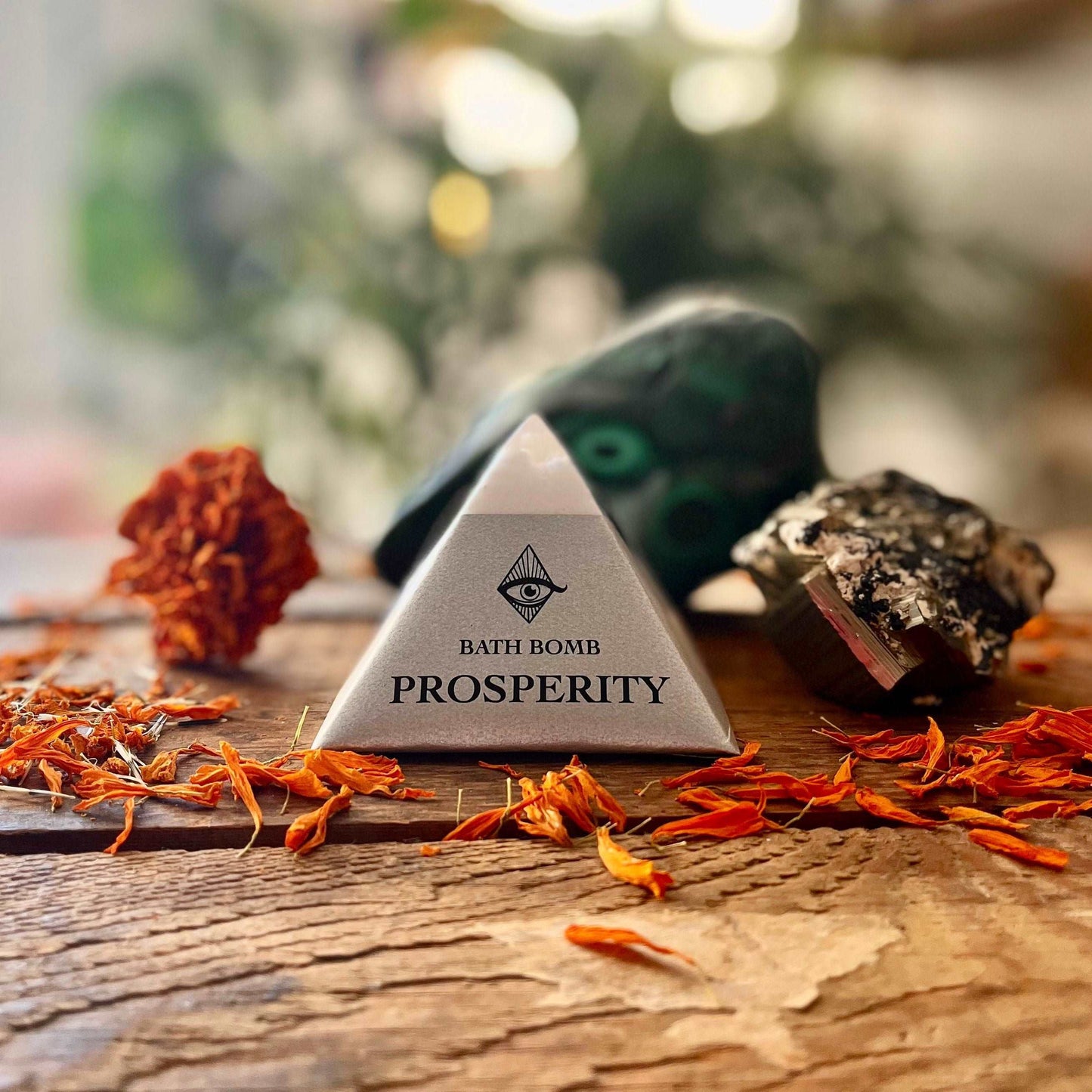 Invite abundance into your bath ritual with our Prosperity Bath Bomb, crafted with a blend of organic Patchouli, Orange, and Clove essential oils. Immerse yourself in the opulent scents as you soak, embracing a sense of prosperity and positive energy. Indulge in the luxurious ingredients that nurture both your body and spirit, creating a bathing experience filled with richness and intention.