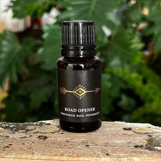 0.5 oz Road Opener Essential Oil Blend with a Proprietary Blend of Organic Essential Oils, Organic Fractionated Coconut Oil, and a Crystal Charged Under the Moon for Fresh Beginnings and Clarity.