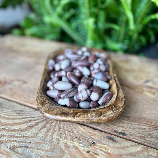 Shiva Lingam Crystal - Connect with divine energies through the sacred Shiva Lingam. Revered in Hindu tradition, this egg-shaped stone is believed to embody the union of masculine and feminine energies, promoting balance and spiritual growth.