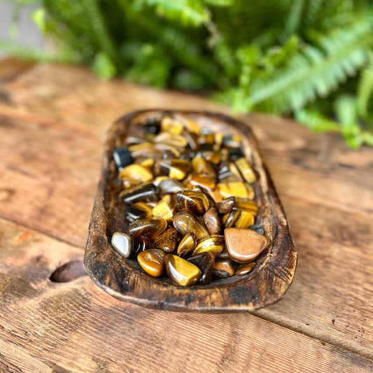 Tiger's Eye Tumbled Crystal - Channel the courage and strength of Tiger's Eye. This golden-brown crystal is associated with confidence and protection, making it an excellent choice for those seeking empowerment. Embrace the bold energies of Tiger's Eye.