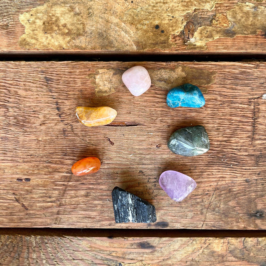 Crystal Chakra Kit - Featuring Black Tourmaline, Carnelian, Golden Healer Quartz, Rose Quartz, Blue Apatite, Labradorite, and Amethyst. This curated set is designed for chakra balancing and overall energetic harmony.